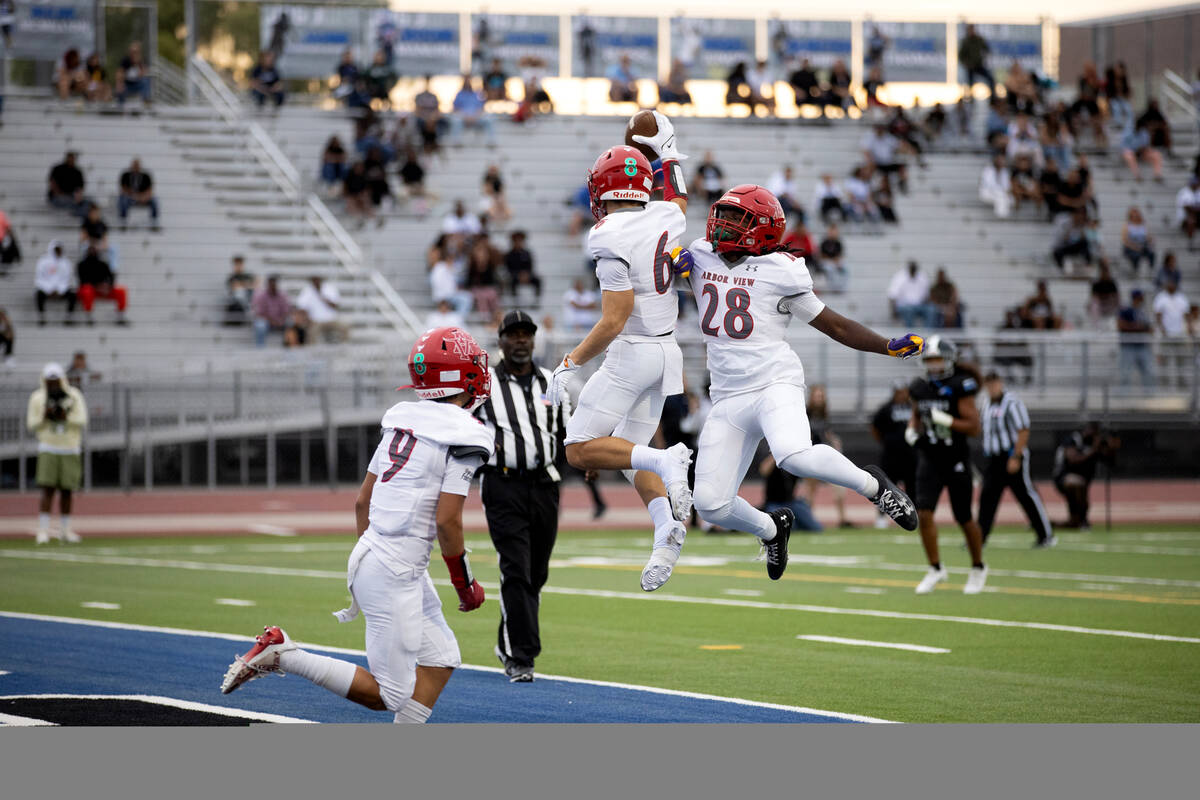 Arbor View wide receiver Jayden Williams (6) and running back Nylen Johnson (28) celebrate Will ...