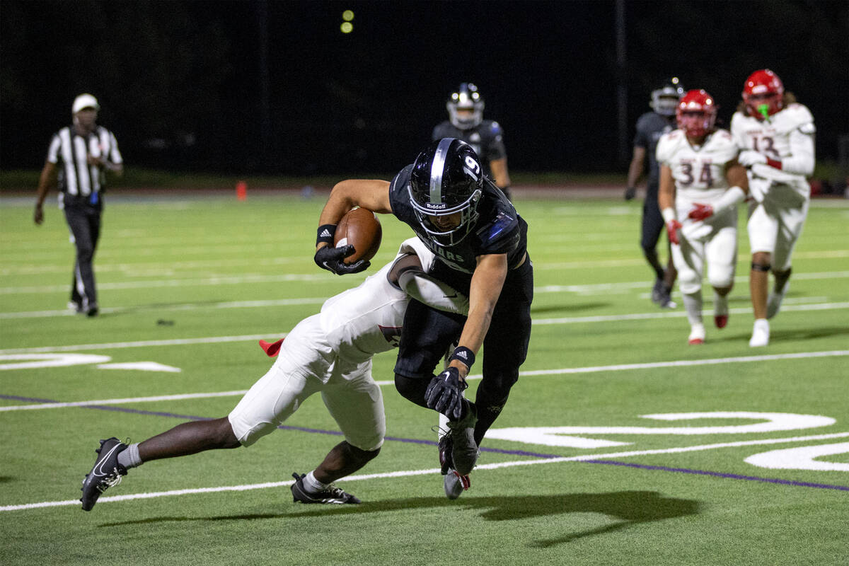 Desert Pines wide receiver Luey Jaime (19) dives with the ball while during the second half of ...