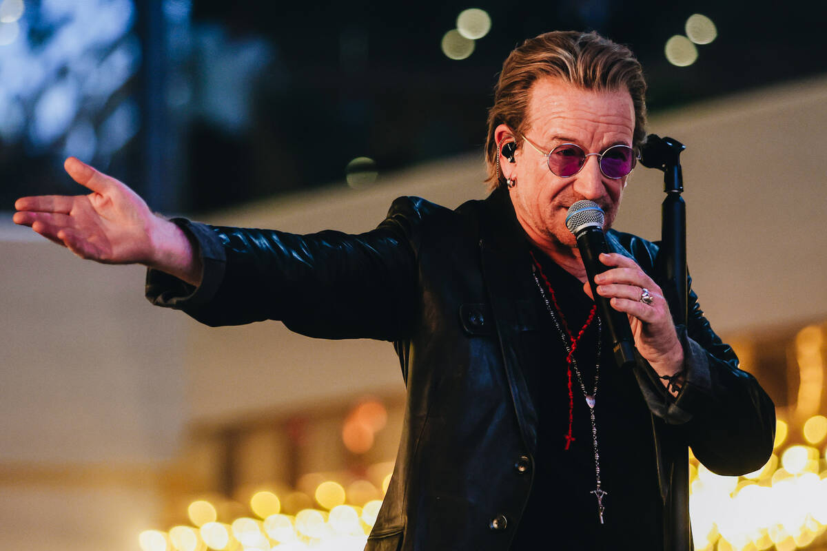 U2 performs while filming a music video in front of the Plaza hotel and casino on Sunday, Sept. ...