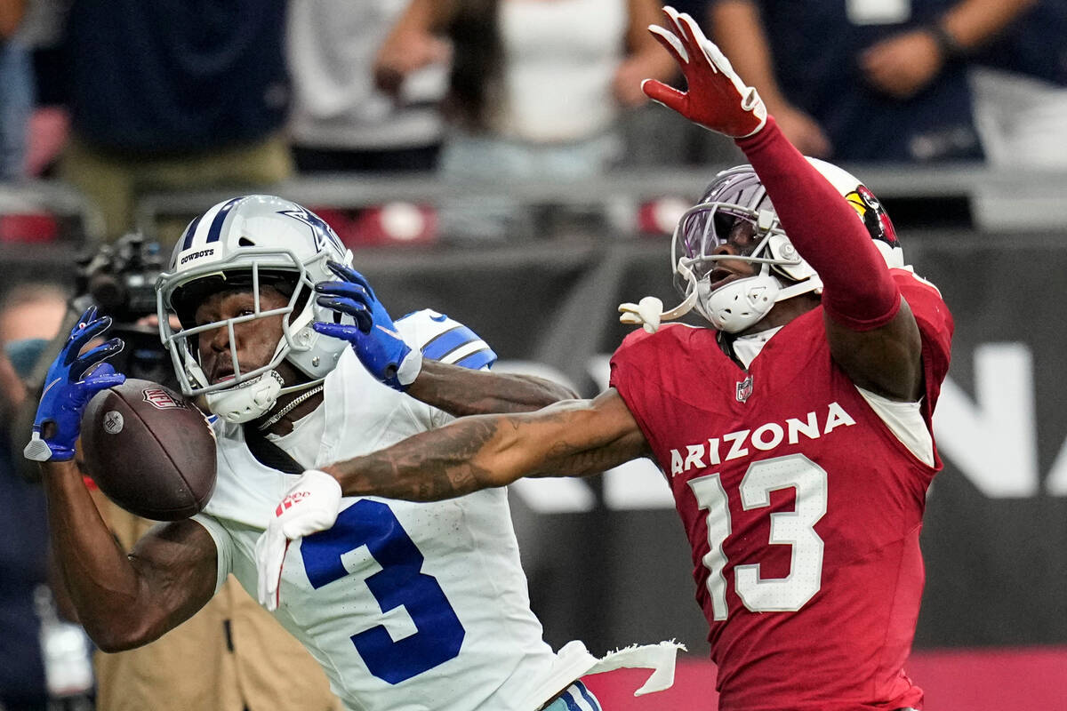 Dallas Cowboys wide receiver Brandin Cooks (3) misses the catch as Arizona Cardinals cornerback ...