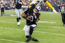 Raiders quarterback Jimmy Garoppolo (10) grimaces as Pittsburgh Steelers safety Damontae Kazee ...