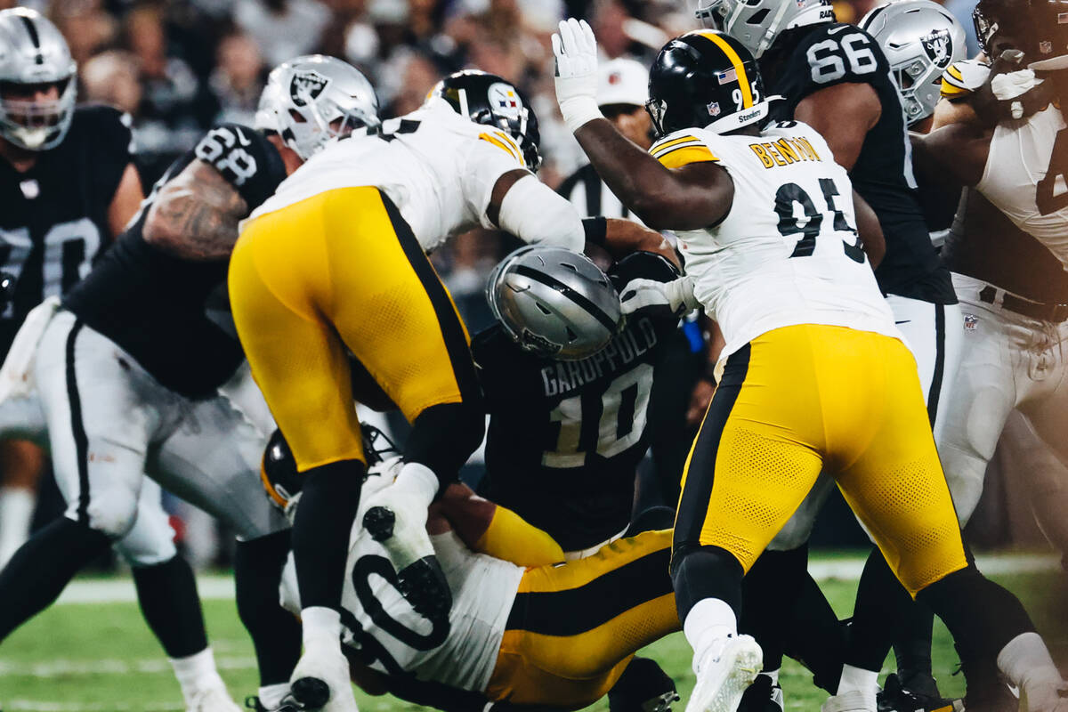 Raiders quarterback Jimmy Garoppolo (10) is injured during a play during the first half of a ga ...