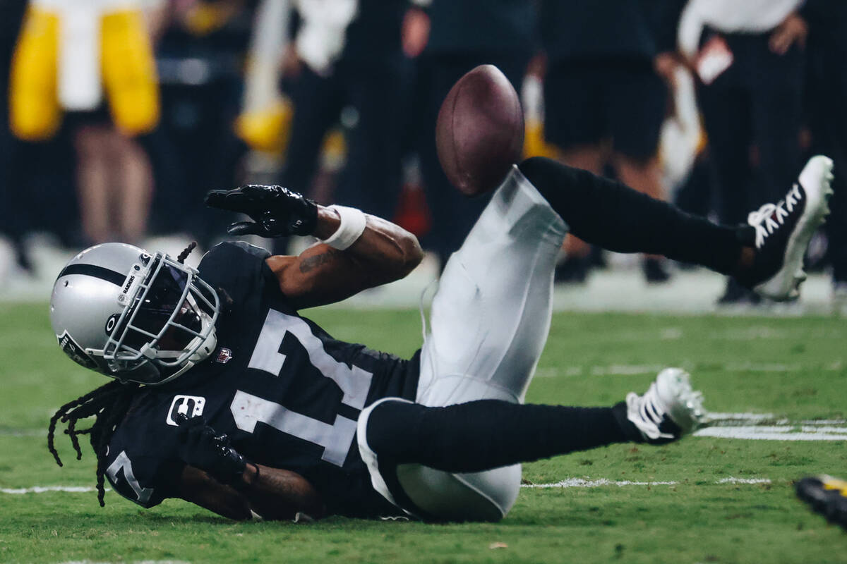 Raiders wide receiver Davante Adams (17) fumbles the ball during the second half of a game agai ...