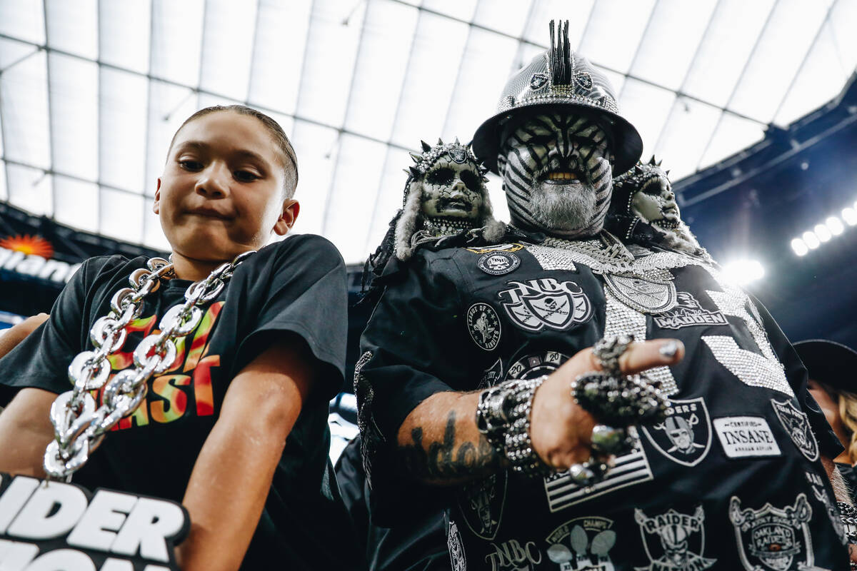 A Raiders fan poses for a photograph during a game against the Pittsburgh Steelers at Allegiant ...