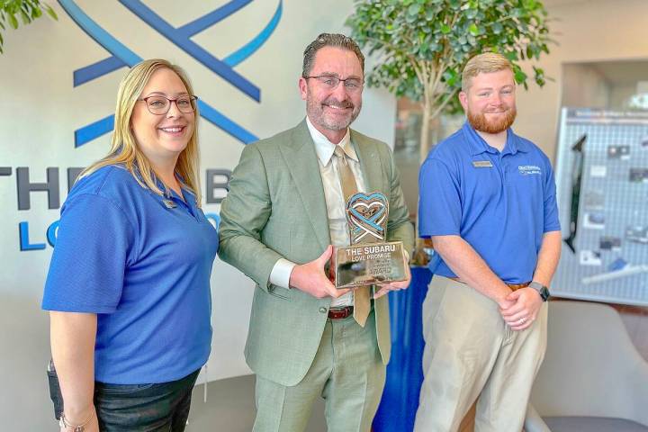 General Manager Ryon Walters, center, and brand specialists Patrice Lynk and Trevor Greer pose ...