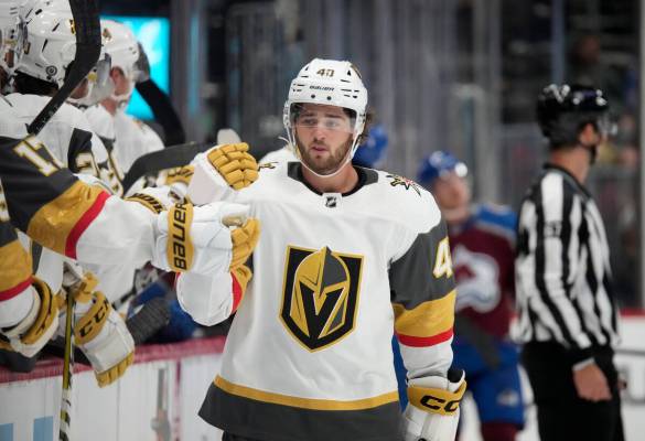 Vegas Golden Knights defenseman Luke Cormier is congratulated as he passes the team box after s ...