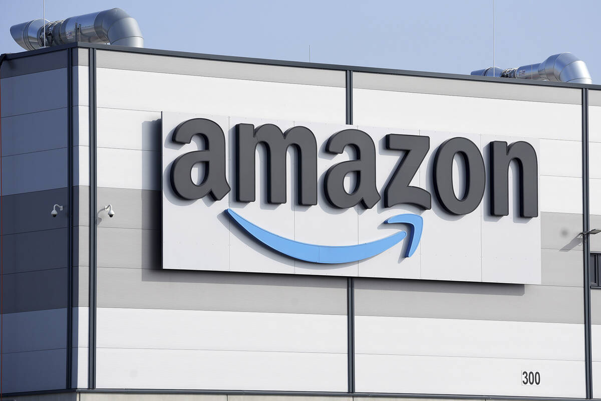 An Amazon company logo marks the facade of a building in Schoenefeld near Berlin, March 18, 202 ...