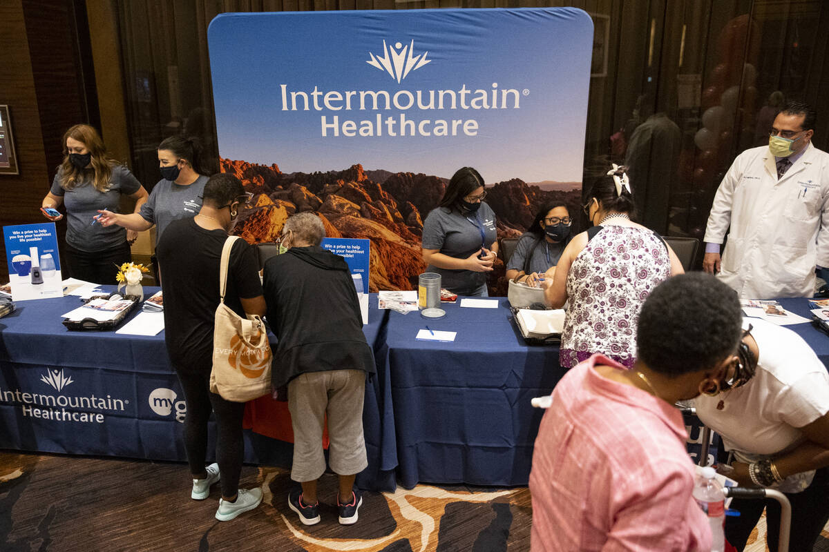 People visit the Intermountain Healthcare booth during the Aging Wellness Expo at Red Rock Reso ...