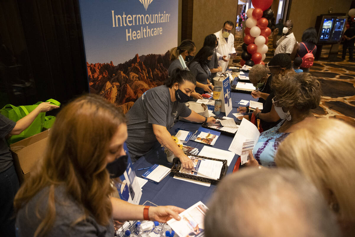 People visit the Intermountain Healthcare booth during the Aging Wellness Expo at Red Rock Reso ...