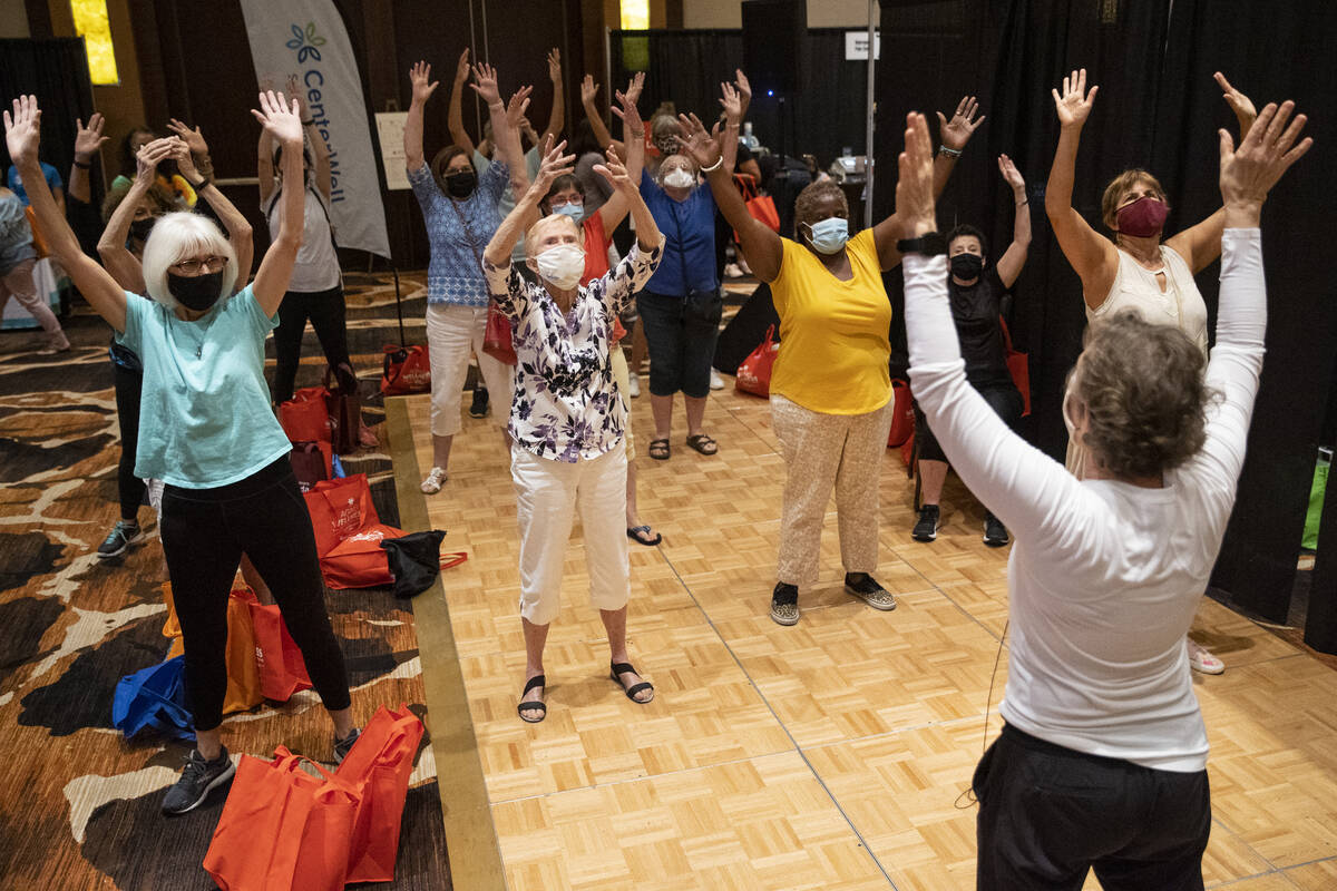 People participate in a physical activity at the active Lounge by CenterWell Primary Care durin ...