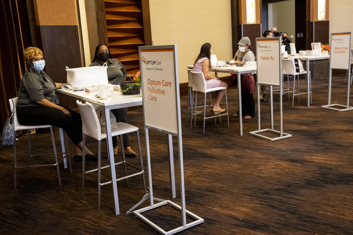 People visit the Optum Care booth during the Aging Wellness Expo at Red Rock Resort in Las Vega ...