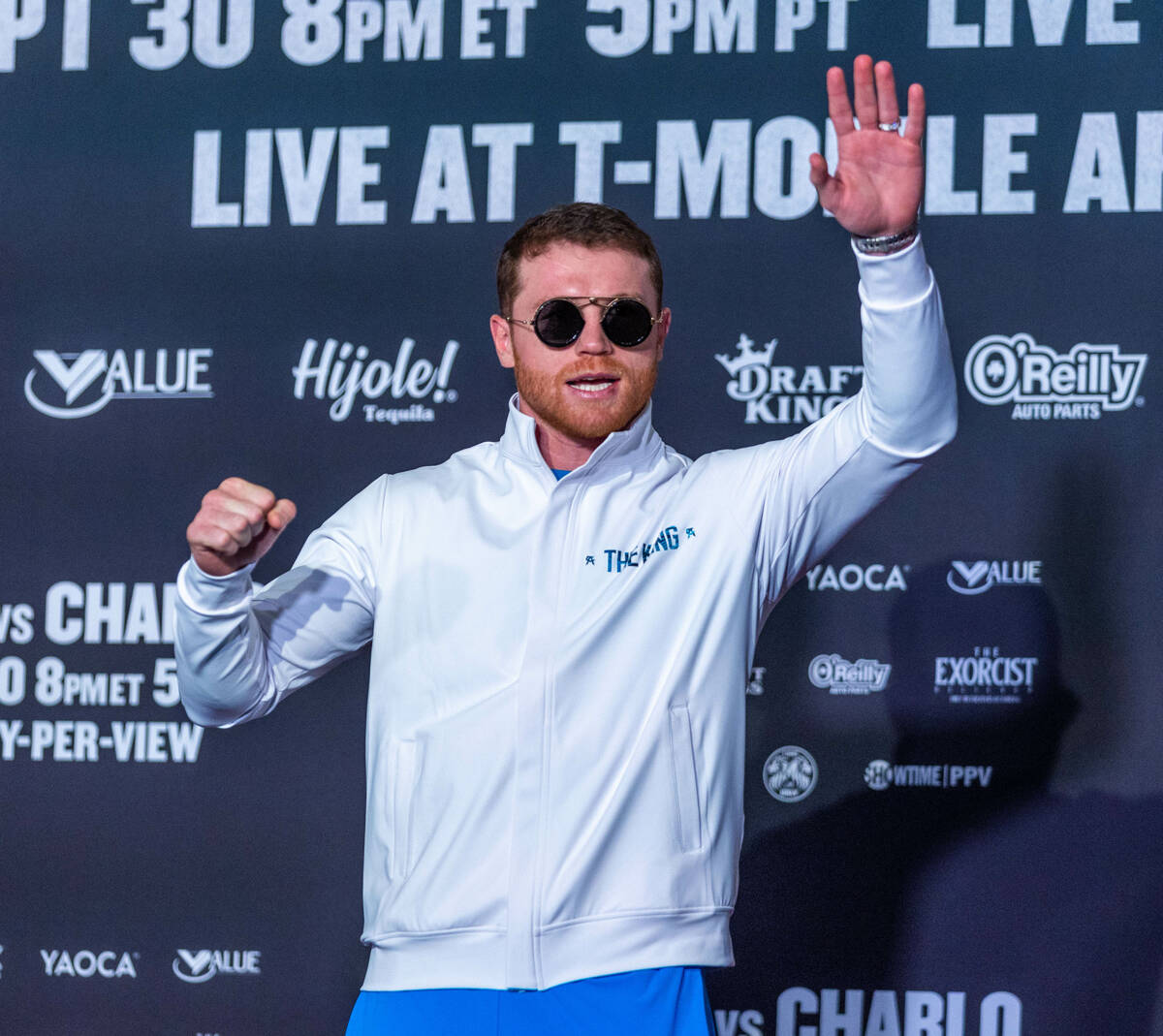 Boxer Canelo Alvarez acknowledges the fans while on stage during fighter grand arrivals at the ...