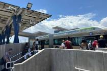 Bus riders prepare to board a Regional Transportation Commission bus at the Bonneville Transit ...