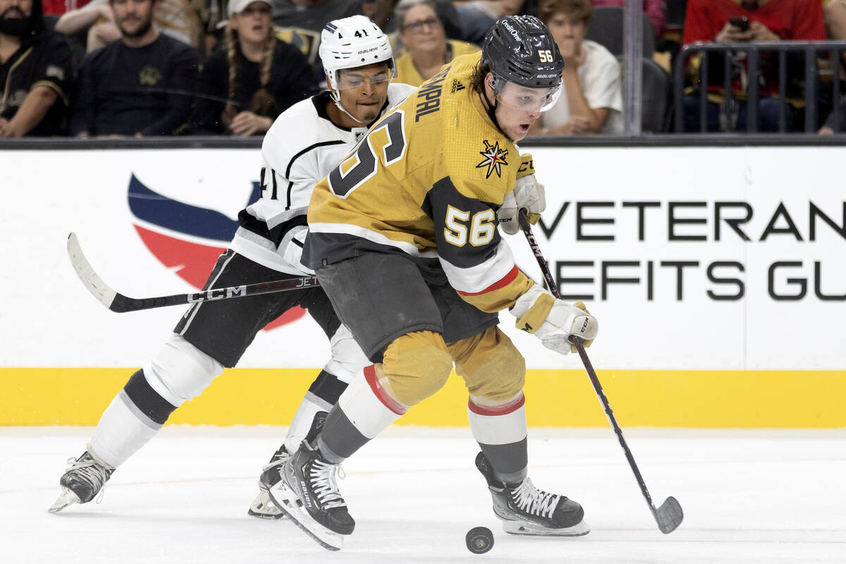 Golden Knights forward Sheldon Rempal (56) heads for the net against Kings forward Akil Thomas ...