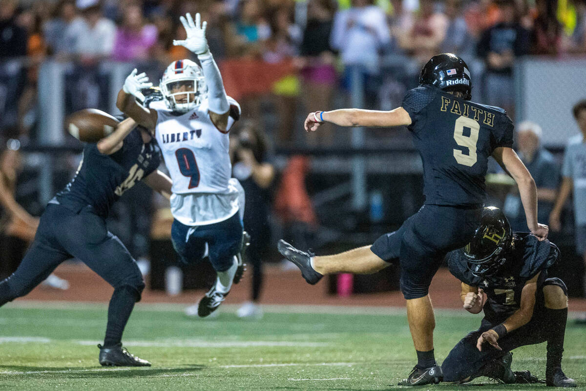 Faith Lutheran kicker Caden Chittenden (9) makes a successful field goal as Liberty safety Asht ...