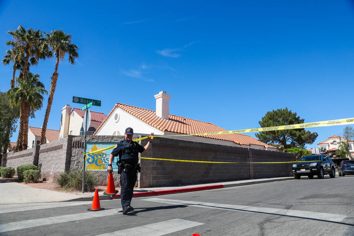 Police block off the 1900 block of Kransten Drive in Henderson in the aftermath of a house fire ...