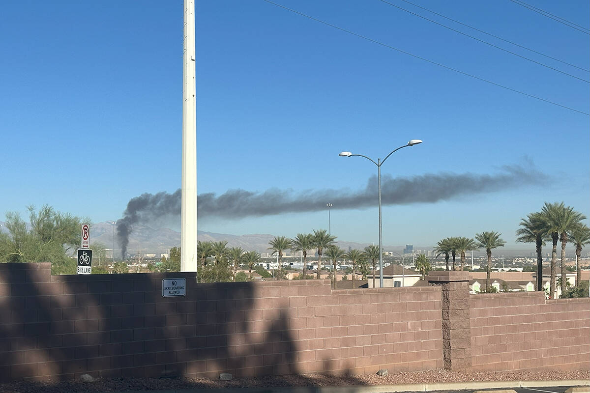 Smoke can be seen from a house fire Wednesday, Sept. 27, 2023, on the 1900 block of Kransten Dr ...