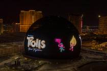 An ad for the DreamWorks Animation movie "Trolls Band Together" appears on the Exosphere exteri ...