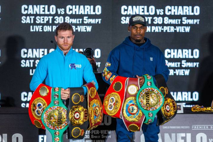 Boxers Canelo Alvarez and Jermell Charlo stand with their belts ending their final press confer ...