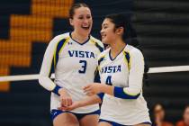 Sierra Vista teammates Nicole Mcmanus (3) and Lanna Ryan Ong (4) celebrate Ong scoring a point ...