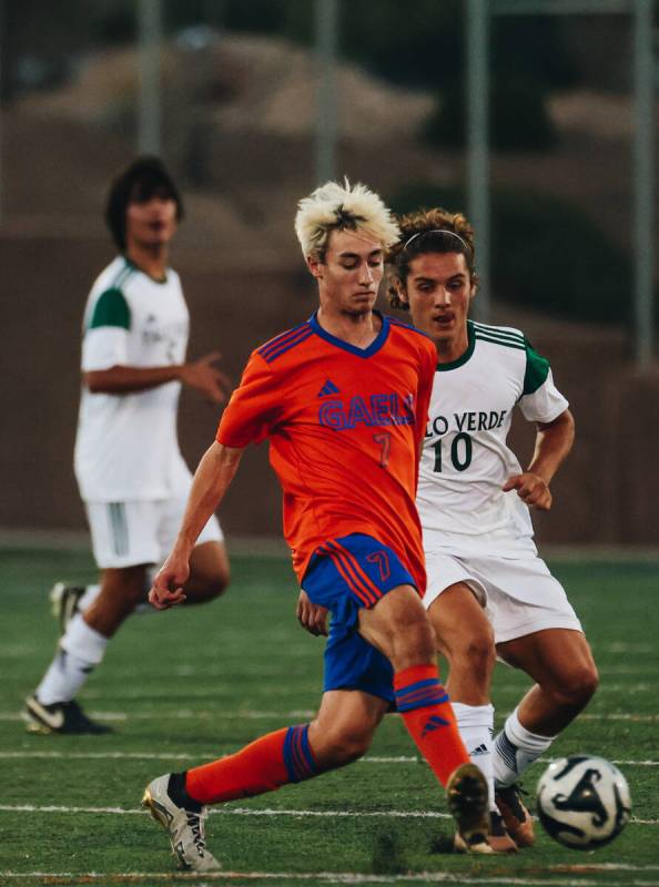 Bishop Gorman’s Maddix Bordinhao (7) and Palo Verde midfielder Francesco Traniello (10) ...