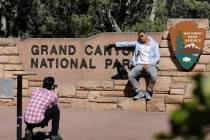 Ahmed Alaawaj, of Libya, gets his photo taken by Juan Riaz, of Colombia, at the Grand Canyon Na ...