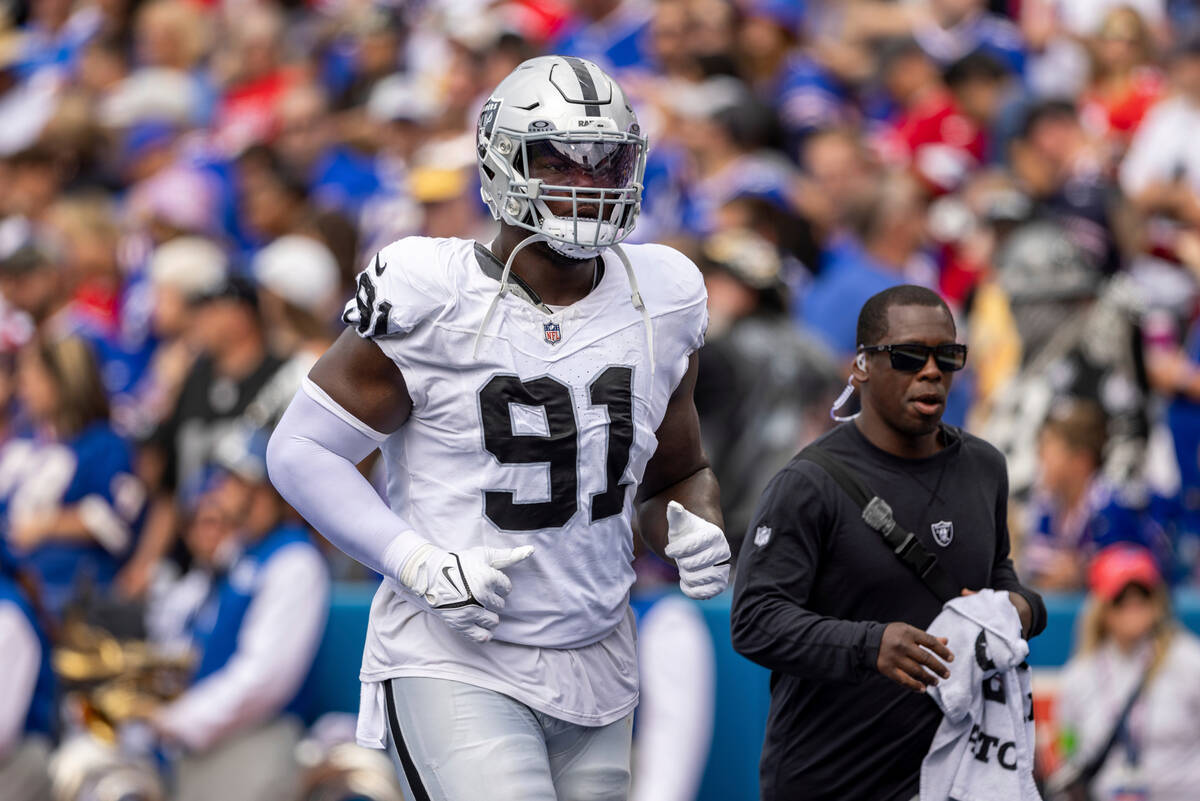 Las Vegas Raiders defensive tackle Bilal Nichols (91) jogs off the field during an NFL football ...