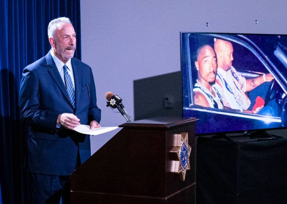 A photograph of rapper Tupac Amaru Shakur, right, is displayed as Clark County District Attorne ...