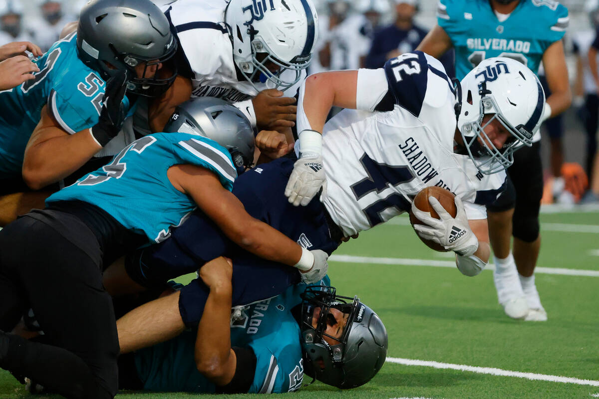 Shadow Ridge Evan Cannon (42) tackled by Silverado High defense during the first half of a hig ...