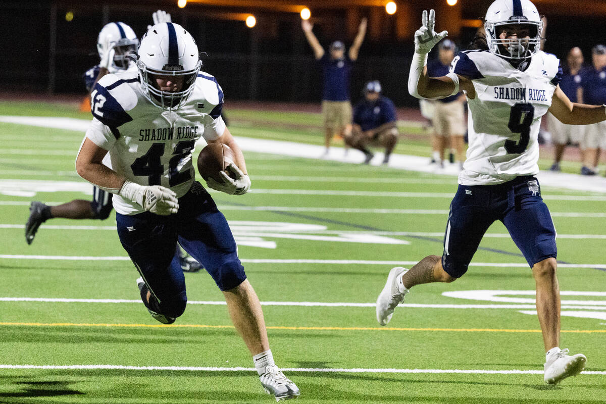 Shadow Ridge High Evan Cannon (42) scores a touchdown against Silverado High during the first h ...