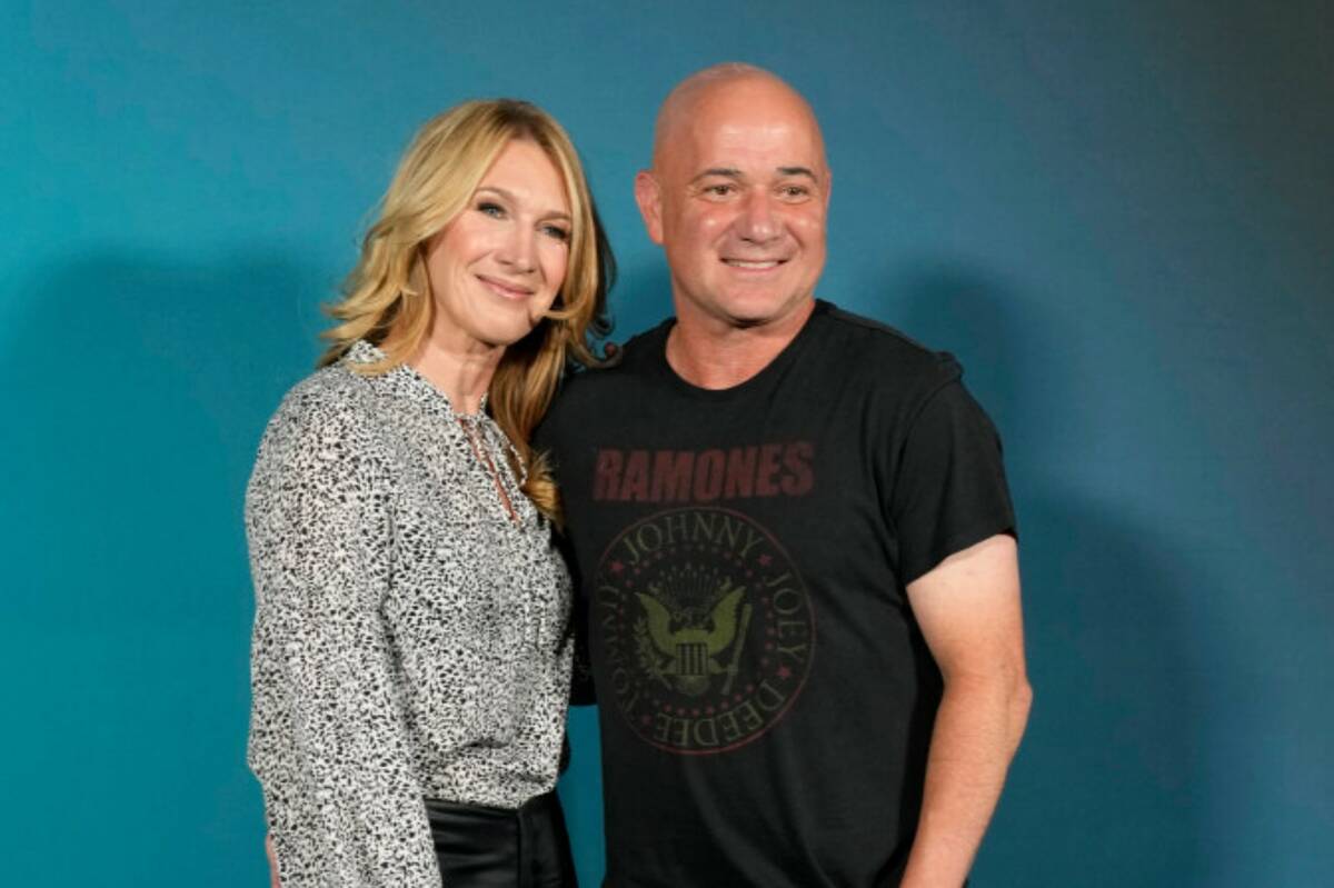 Former tennis stars Steffi Graf, left, and Andre Agassi pose during the opening night of the Sp ...