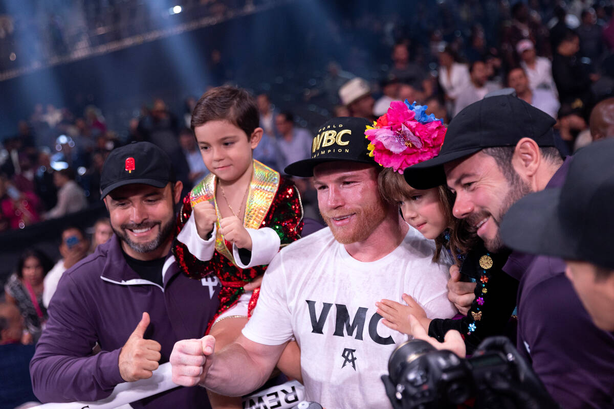 Canelo Alvarez poses with his children after winning an undisputed world super middleweight tit ...
