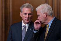Speaker of the House Kevin McCarthy, R-Calif., confers with Majority Whip Tom Emmer, R-Minn., r ...