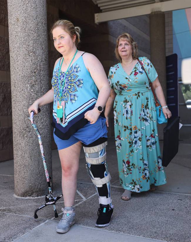 Emma Burkey and her mother, Kathy Burkey, right, walk to a Sunday service at Walk Church at Sch ...