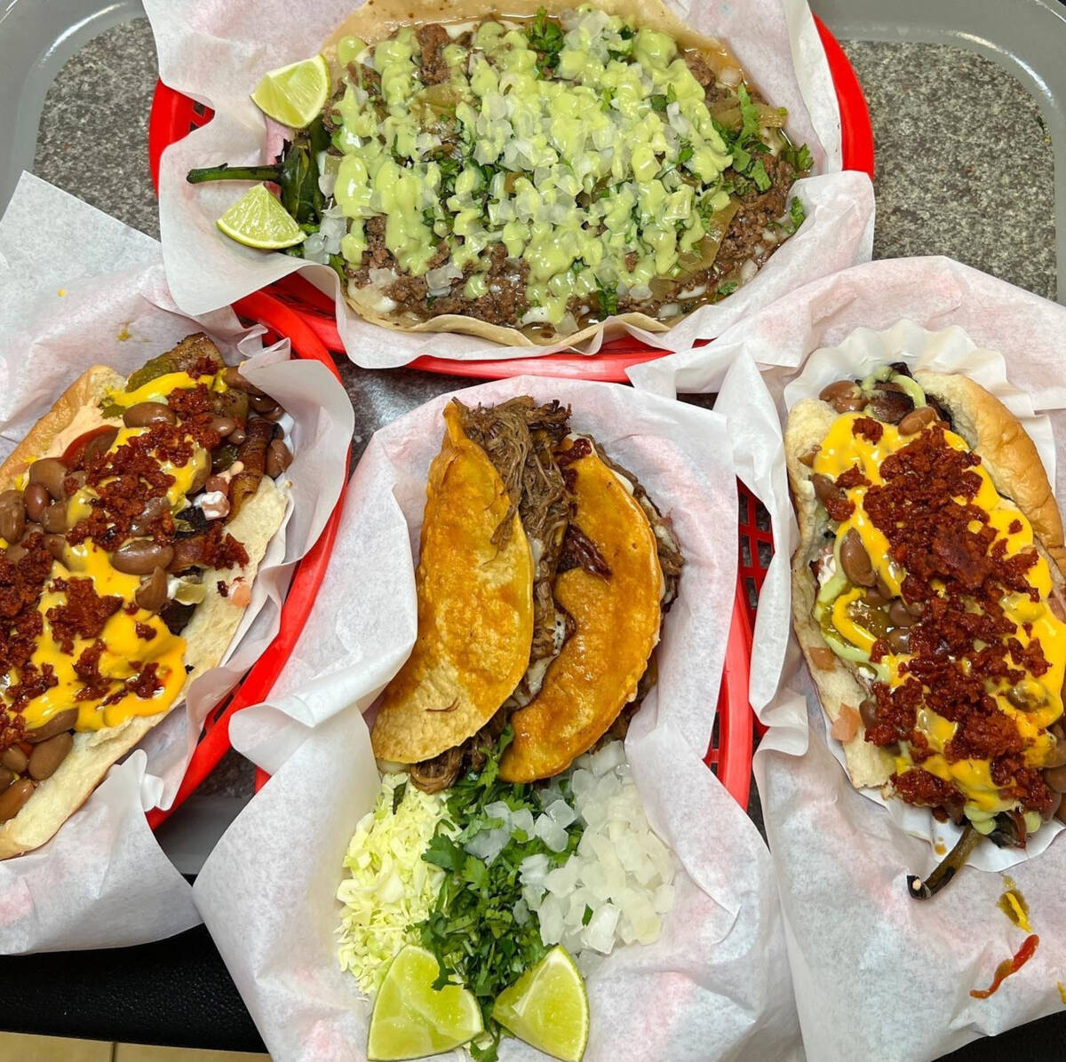 Sonoran-style hot dogs, left and right, a Sonoran-style dog wrapped in a tortilla instead of a ...