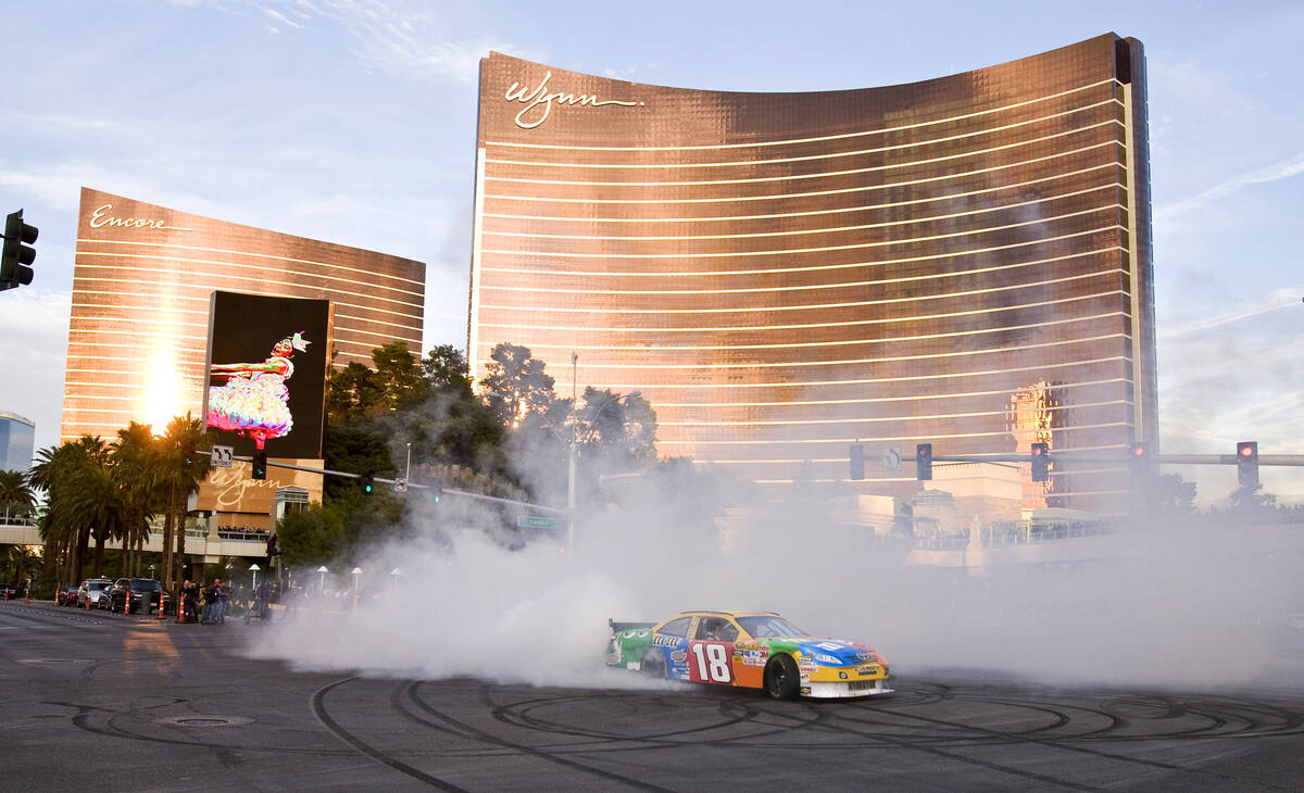 NASCAR Sprint Cup Series driver Kyle Busch performs a burnout in his number 18 M&Ms racing "sho ...