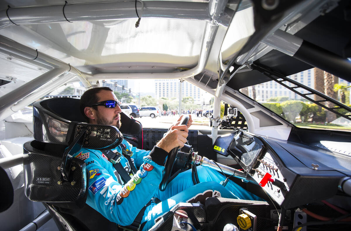 Kyle Busch passes the Bellagio while driving down the Las Vegas Strip before performing a burno ...