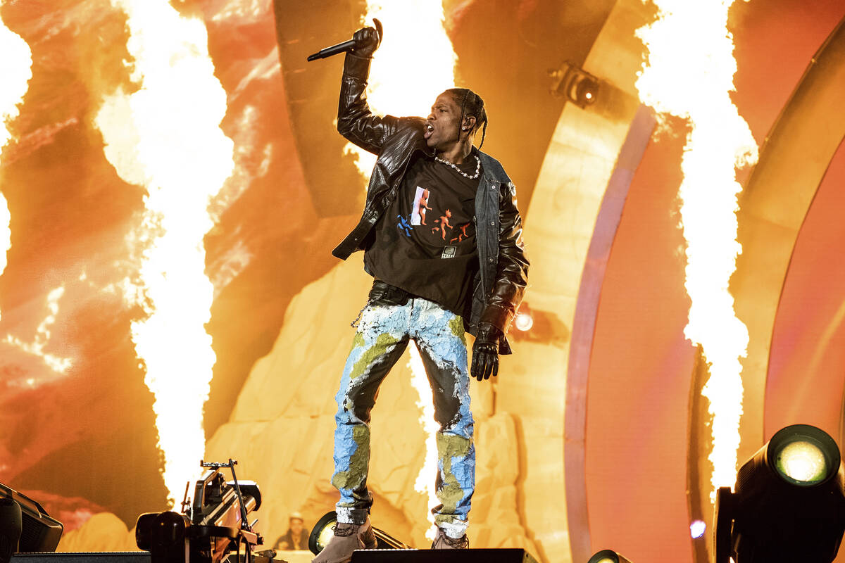 FILE - Travis Scott performs at the Astroworld Music Festival in Houston, Nov. 5, 2021. (Amy Ha ...