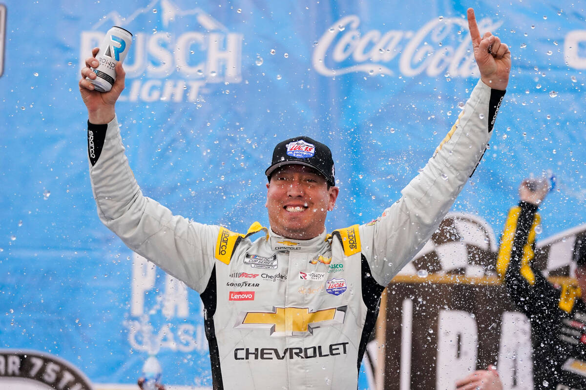 Kyle Busch celebrates after winning a NASCAR Cup Series auto race at Auto Club Speedway in Font ...