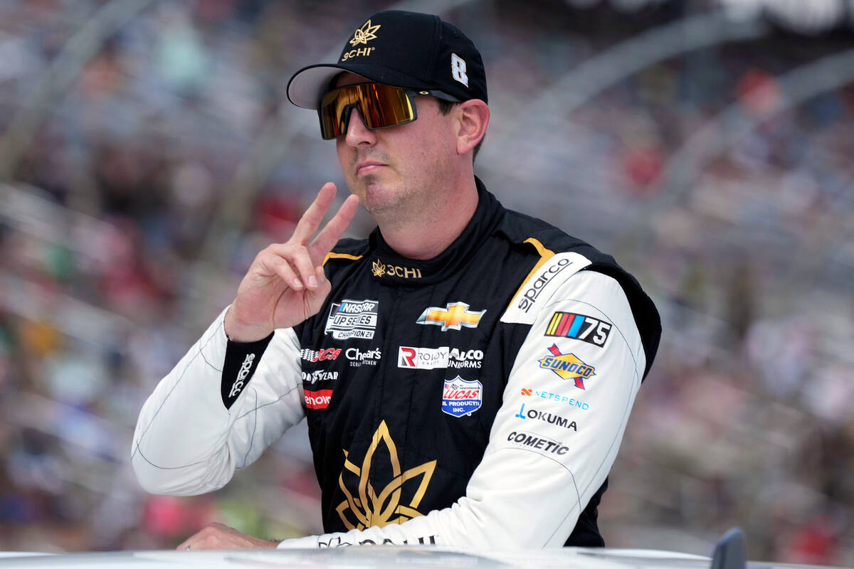 Kyle Busch gestures during introductions before a NASCAR Cup Series auto race at Texas Motor Sp ...