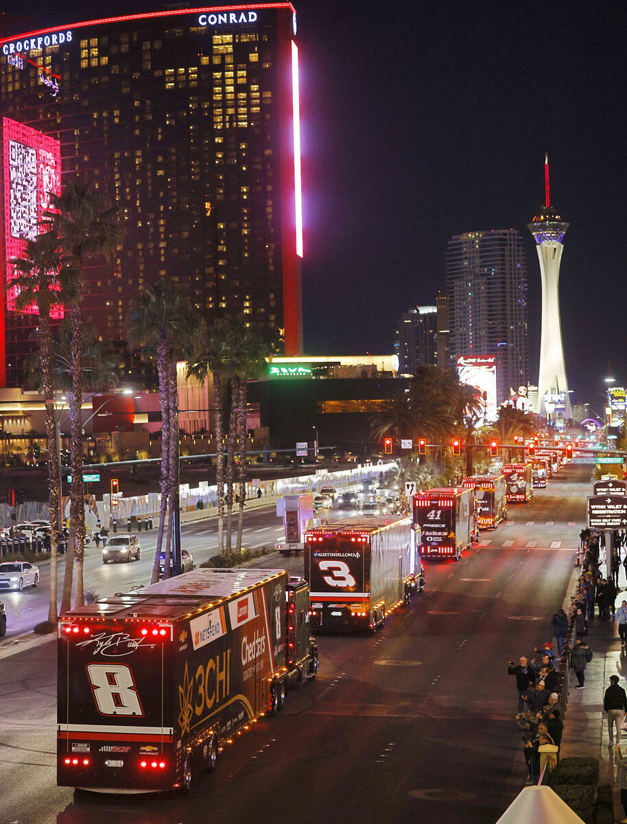 NASCAR Cup Series haulers including the hauler of Kyle Busch (8) parade down the Las Vegas Stri ...