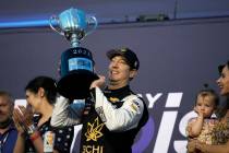 Kyle Busch celebrates after winning a NASCAR Cup Series auto race at World Wide Technology Race ...