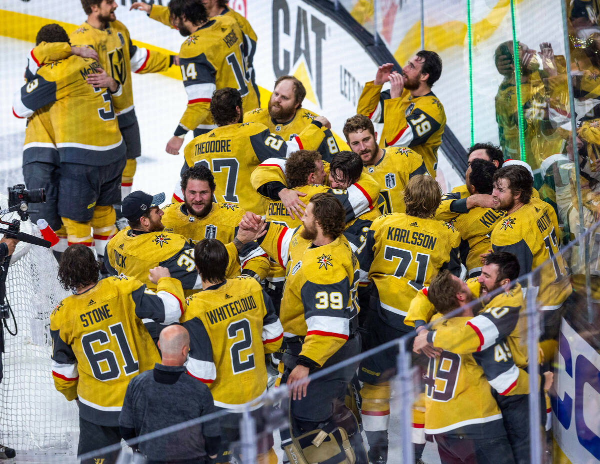 Golden Knights players come together in celebration after defeating the Florida Panthers 9-3 in ...