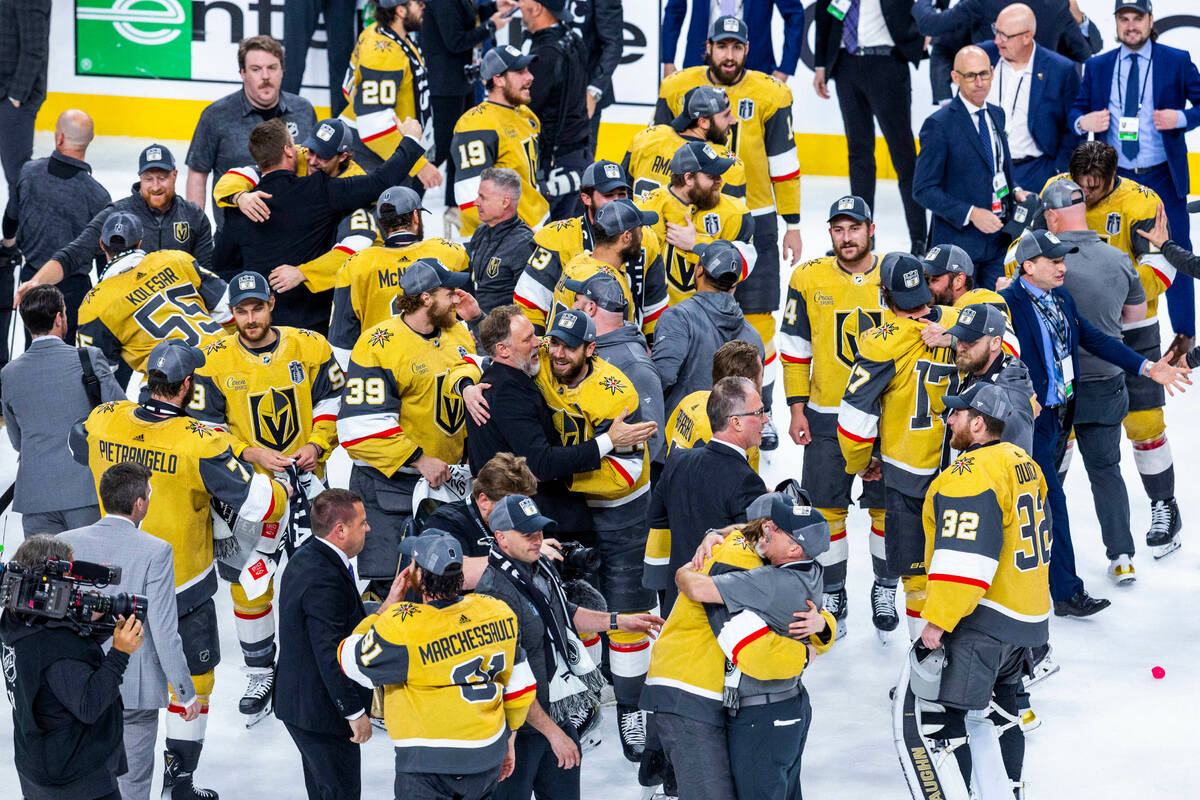 Golden Knights players come together in celebration after defeating the Florida Panthers 9-3 in ...
