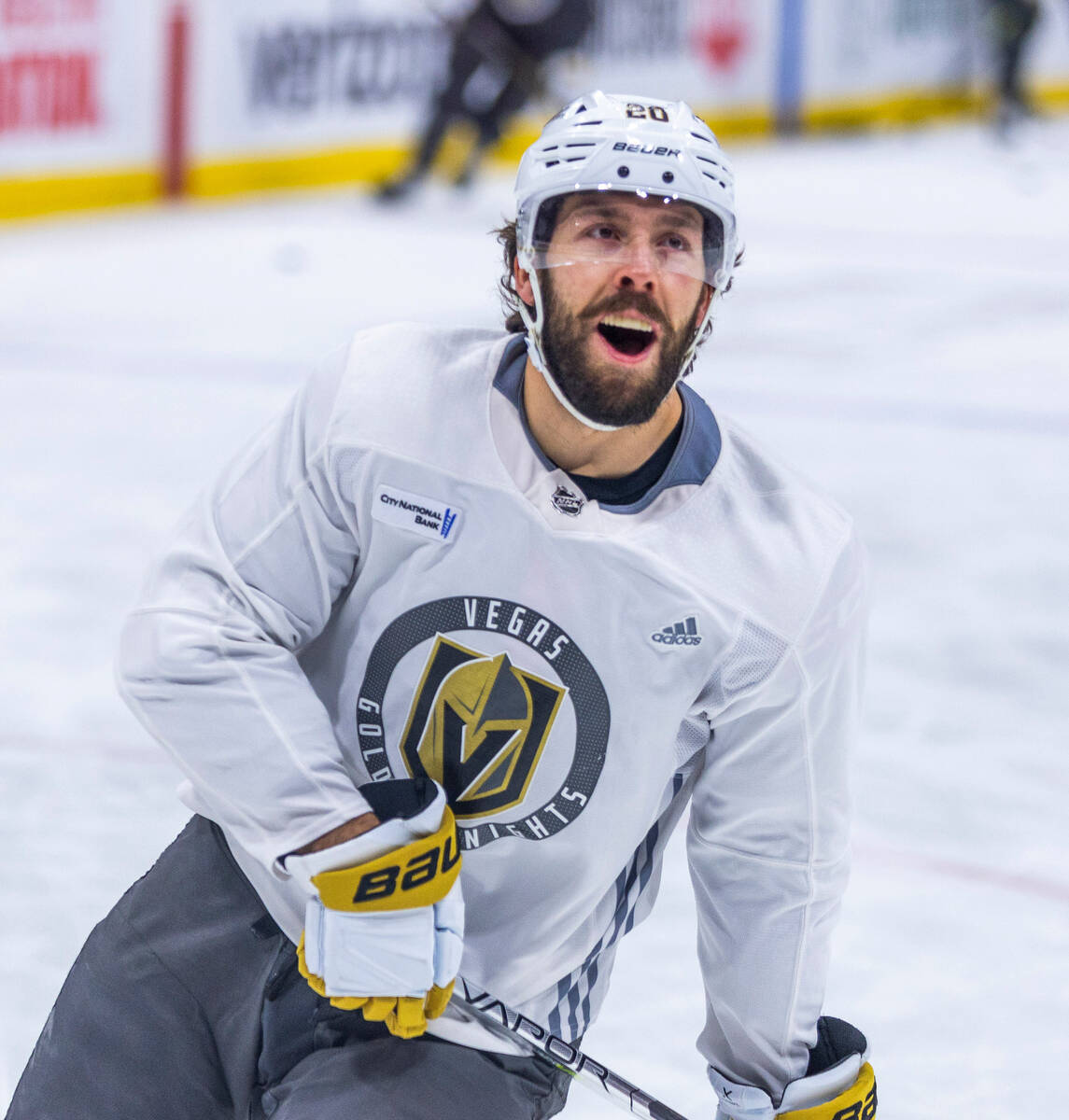 Golden Knights center Chandler Stephenson (20) laughs with a teammate during an early skate bef ...