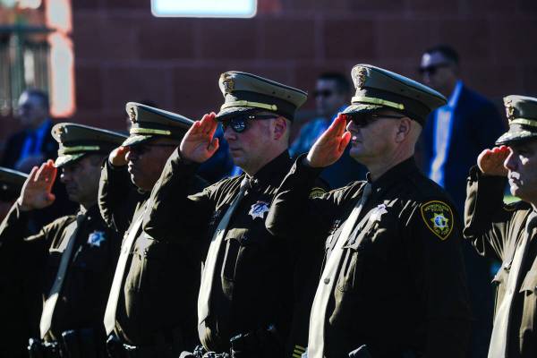 Members of the Metropolitan Police Department salute during the 1 October Sunrise Remembrance c ...