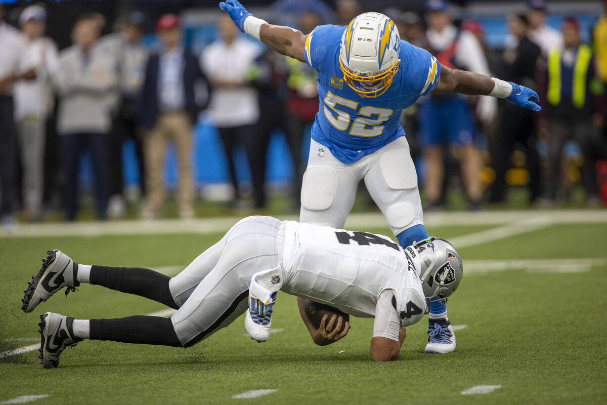 Los Angeles Chargers linebacker Khalil Mack (52) sacks Raiders quarterback Aidan O'Connell (4) ...