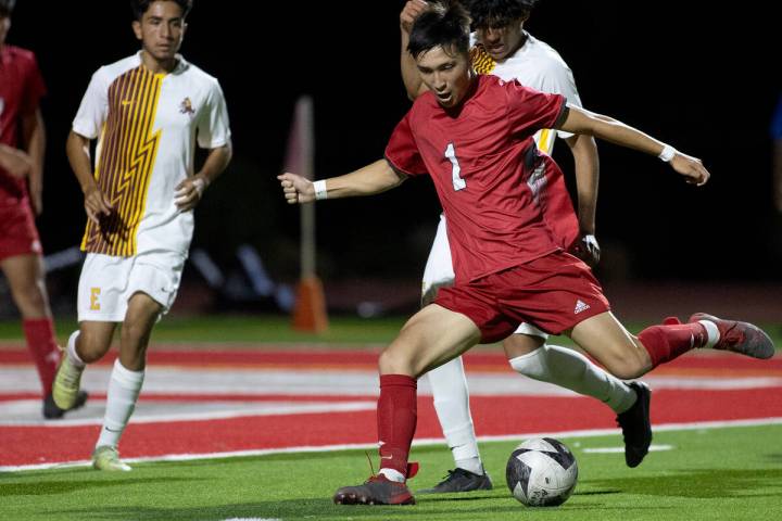 Arbor View's Hunter LaPointe (1) winds up for an attempted goal during a boys high school socce ...