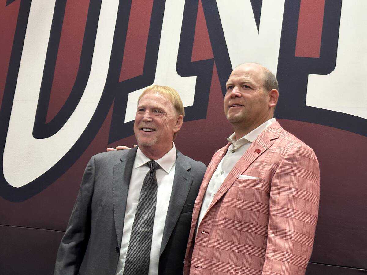 Raiders owner Mark Davis and UNLV head football coach Barry Odom inside the Al Davis Team Room ...