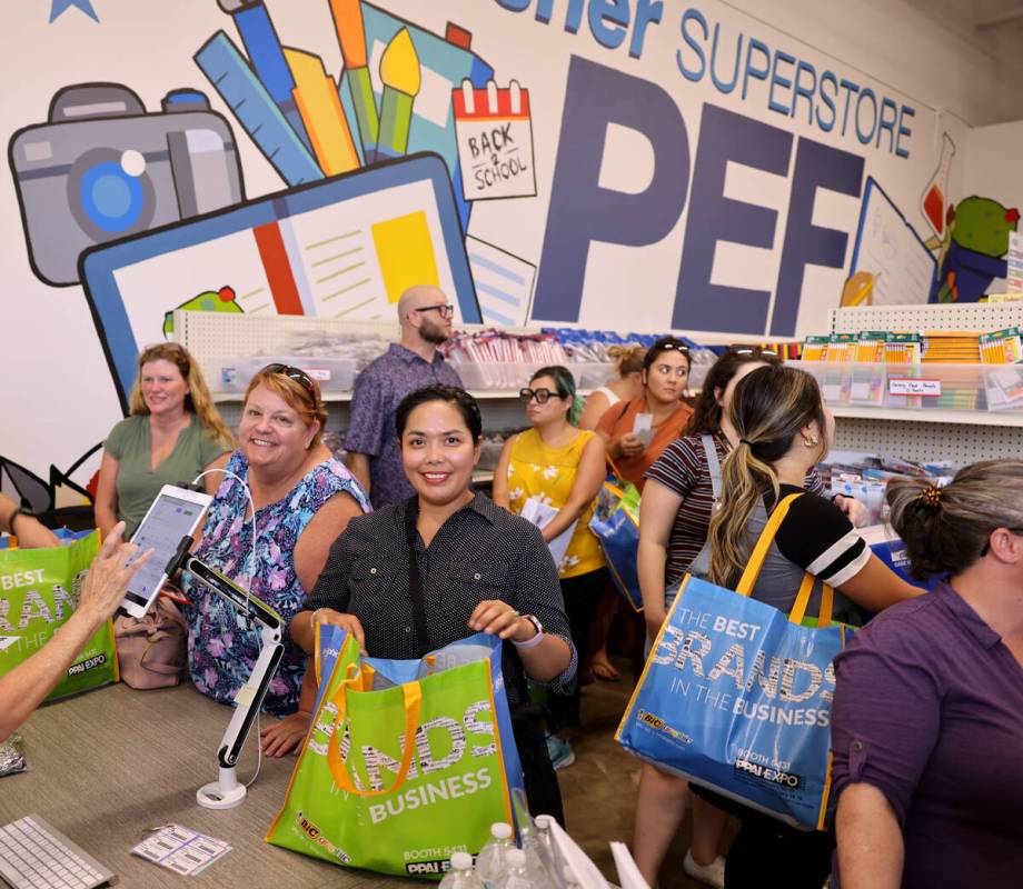 Ethelene Robles, center, a kindergarten teacher at Dickens Elementary, shops at the newest Publ ...